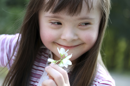 girl holding flower