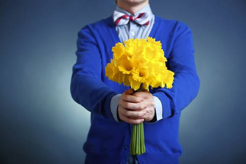 boy holding flowers