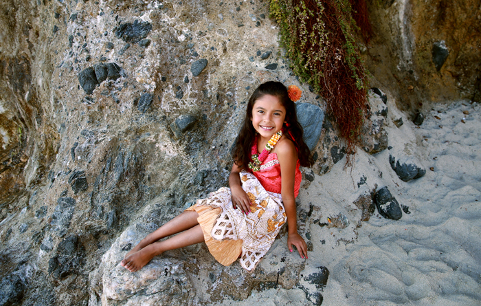 Cute Kid Winner Zariah sitting on rocks