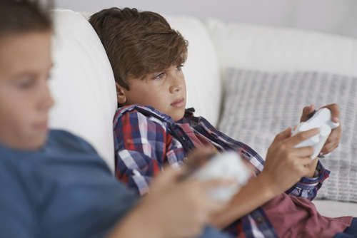 kids playing games on couch