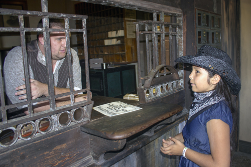 Lali Cervantes talking to Postmaster at Knotts Berry Farm