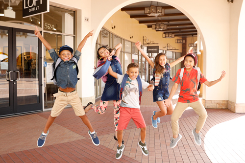 kids jumping at the San Clemente Outlets in Orange County