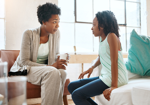 mother talking to her daughter