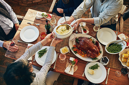 family sharing a Thanksgiving dinner